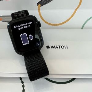 Apple Watch Series 7 45mm Midnight Aluminum Case with Nike adjustable band.